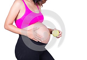 Beautiful pregnant woman with green apple isolated on white