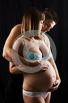 Beautiful pregnant woman with her husband