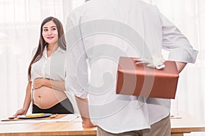 Beautiful pregnant woman and her husband are celebrating baby shower