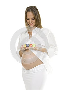 Beautiful Pregnant Woman Holding Baby Blocks