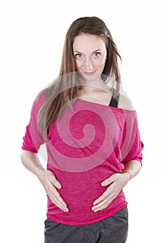 Beautiful pregnant woman holding the belly