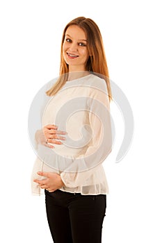 Beautiful pregnant woman holding belly isolated over white background