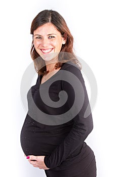 Beautiful pregnant woman holds hands on belly Young mother waiting of a baby. Concept of pregnancy, maternity, health care,