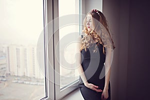 Beautiful pregnant woman at home portrait