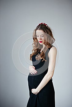 Beautiful pregnant woman at home portrait