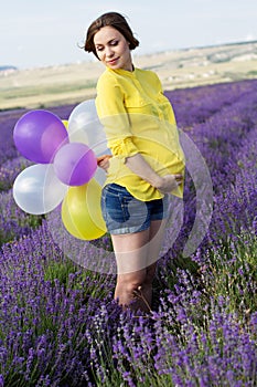 Beautiful pregnant woman in the lavender field