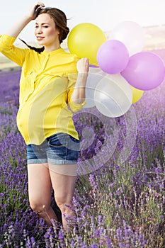 Beautiful pregnant woman in the lavender field