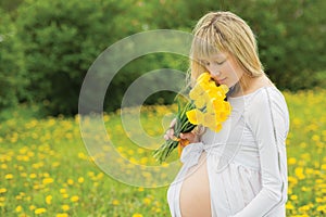 Beautiful pregnant woman outdoor