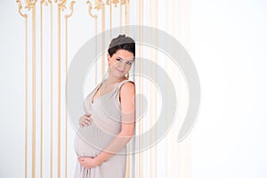 Beautiful pregnant woman waiting for a child