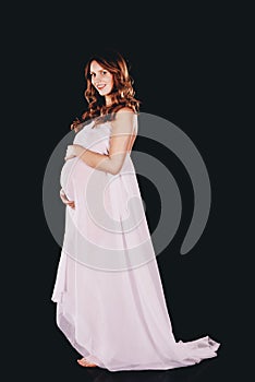 Beautiful pregnant woman wrapping at chiffon