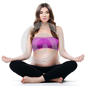 Beautiful pregnant woman yoga exerciser photo