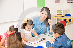 Beautiful preschool teacher during class