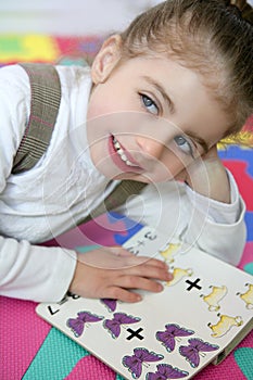 Beautiful preschooler girl studying book