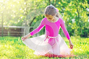 Beautiful preteen girl doing gymnastics and stretching in the ci