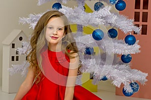 Beautiful Preteen Girl Posing in front of White Christmas Tree