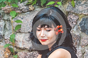 beautiful pretty brunette with red lipstick with red rose h