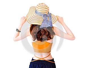 Beautiful pretty woman wearing a straw hat and sexy suit isolated on white background