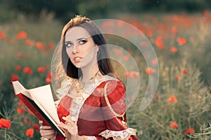 Beautiful Princess Reading a Book in Summer Floral Landscape