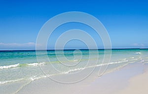 Beautiful pristine beach surrounded by blue sky