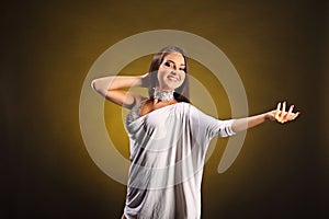 Beautiful professional dancer performs latino dance. Passion and expression.