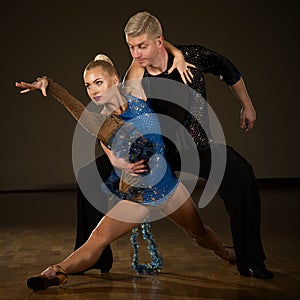 Beautiful professional latin dance couple preform exhibition da