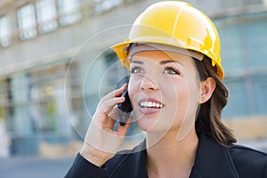 Beautiful Professional Young Woman Contractor Wearing Hard Hat on Site Using Phone