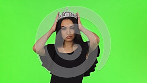 Beautiful prom queen wearing a crown on chromakey background