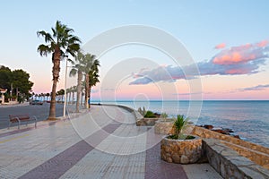Beautiful promenade boardwalk near the mediterranean shore photo