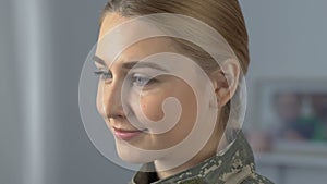 Beautiful proud servicewoman looking in camera, army profession, patriotism