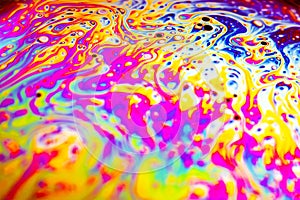 Beautiful psychedelic abstraction formed by light on the surface of a soap bubble