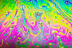 Beautiful psychedelic abstraction formed by light on the surface of a soap bubble