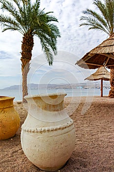 Beautiful public sandy beaches on Red Sea in Eilat with stro umb