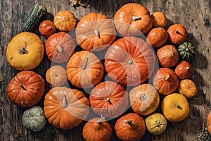 Beautiful pumpkins for Halloween lie on the wooden floor. Pattern