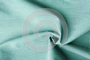 Beautiful pure organic cotton fabric laid out in concentric spiral pattern. Elegant greenish gray color delicate weave. Sewing