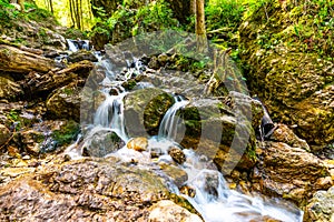 Beautiful pure waterfall in Slovakia national park Mala Fatra - Janosikove Diery, near the Terchova village. Fresh water stream on