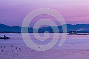 Beautiful purple dawn sunrise over Hiroshima bay, Seto Inland sea of Japan in Hiroshima, Japan