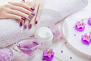 Beautiful purple manicure with spa essentials