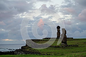 Beautiful sunset over Moai Statues in Hanga Roa photo