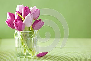 Beautiful purple tulip flowers bouquet in vase