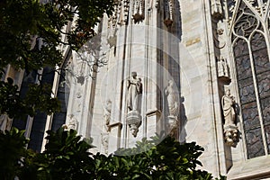Beautiful ragment of the cathedral against the blue sky in Milan in Italy in summer