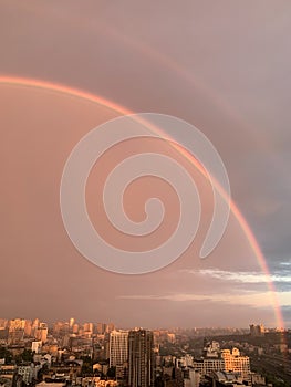 Beautiful rainbow in background blue sky in the city