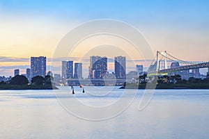 Beautiful rainbow bridge and city scape of odaiba harbor tokyo