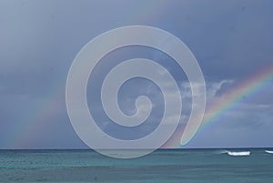 Rainbow over the Caribbean Sea after a tropical downpour over the island of Saona