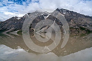 Beautiful Ranwu Lake snow mountains reflection  in summer