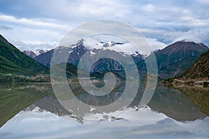 Beautiful Ranwu Lake and snow mountains  in summer photo