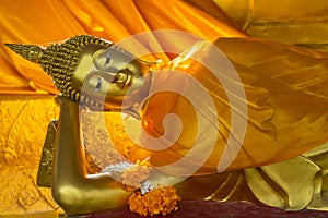 Beautiful reclining golden Buddha Image