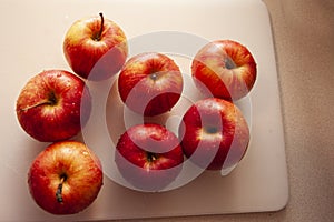 Beautiful red apples on a cutitng board