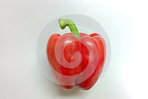 Beautiful red bell pepper on a white background.