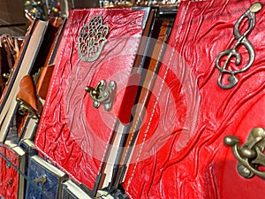 Beautiful red books, notebooks, leather-bound diaries, handmade, oriental, decorative, in a tourist souvenir shop