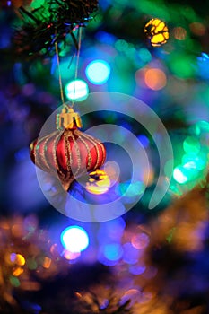 Beautiful red Christmas ball decoration hanged up on a Christmas tree with nice blurry background